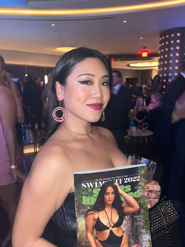 Makeup artist Christyna Kay wore a bold cat-eye holding the Yumi Nu cover whose shoot she worked on.